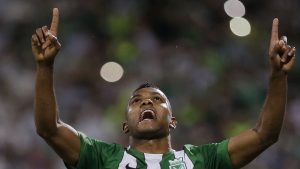 In this July 13, 2016 photo, Miguel Borja of Colombia's Atletico Nacional celebrates scoring his side's second goal against Brazil's Sao Paulo FC from the penalty spot during a Copa Libertadores semifinal second leg match in Medellin, Colombia. With two goals scored by Borja Nacional won 2-1 and qualified to the final of the regional club tournament. (AP Photo/Fernando Vergara)
