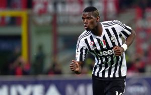 Juventus' midfielder from France Paul Pogba celebrates after scoring a goal during the Italian Serie A football match AC Milan' vs Juventus at "San Siro" Stadium in Milan on April 9, 2016. / AFP PHOTO / GIUSEPPE CACACE