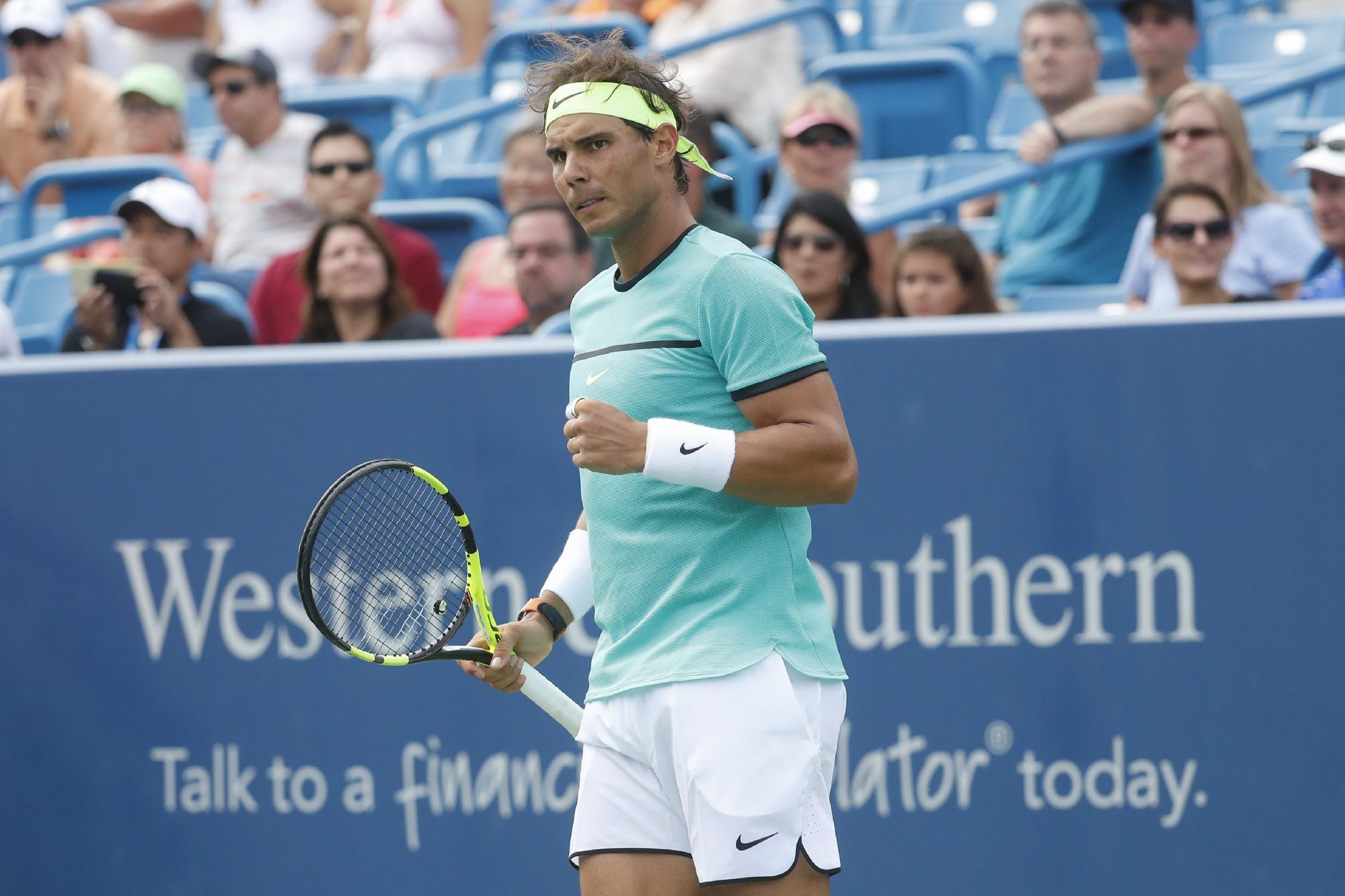 Rafael Nadal, of Spain, reacts during a match against Pablo Cuevas, of Uruguay, on the fifth day of the Western & Southern Open tennis tournament, Wednesday, Aug. 17, 2016, in Mason, Ohio. (AP Photo/John Minchillo)