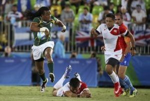 2016 Rio Olympics - Rugby - Men's Bronze Medal Match - Japan v South Africa - Deodoro Stadium - Rio de Janeiro, Brazil - 11/08/2016. Cecil Afrika (RSA) of South Africa runs to score. REUTERS/Alessandro Bianchi (BRAZIL - Tags: SPORT OLYMPICS SPORT RUGBY) FOR EDITORIAL USE ONLY. NOT FOR SALE FOR MARKETING OR ADVERTISING CAMPAIGNS.