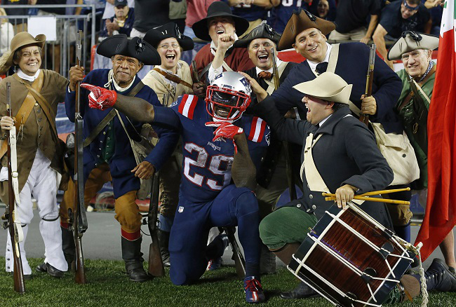 Sep 22, 2016; Foxborough, MA, USA; New England Patriots running back LeGarrette Blount (29) celebrates his touchdown run against the Houston Texans with the End Zone Militia during the second half at Gillette Stadium. Mandatory Credit: Winslow Townson-USA TODAY Sports