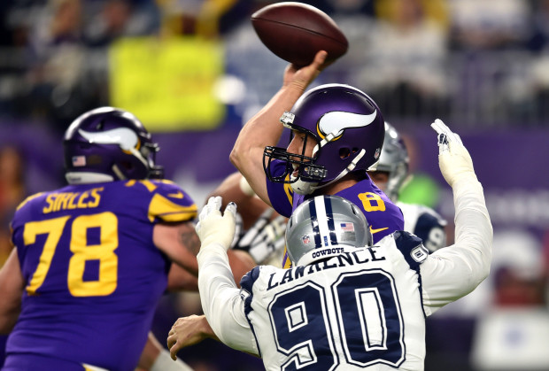 Minnesota Vikings quarterback Sam Bradford is pressured by Dallas Cowboys defensive end Demarcus Lawrence in the first quarter at U.S. Bank Stadium on Thursday, Dec. 1, 2016. (Pioneer Press: John Autey)
