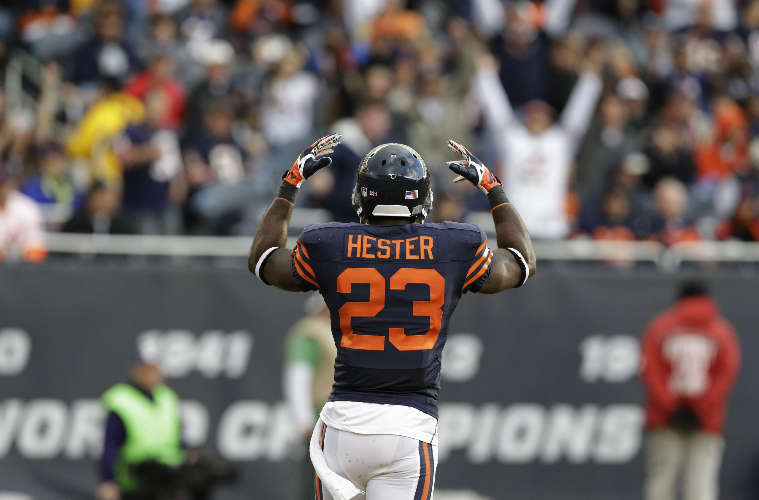 Chicago Bears wide receiver Devin Hester (23) tries to fire the crowd up during the first half of an NFL football game against the Baltimore Ravens, Sunday, Nov. 17, 2013, in Chicago. (AP Photo/Nam Y. Huh)