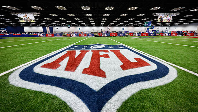 A general view of the NFL Experience and the NFL Shield on an indoor field is seen at the NFL football scouting combine on Thursday, March 2, 2017, in Indianapolis. (Aaron M. Sprecher via AP)