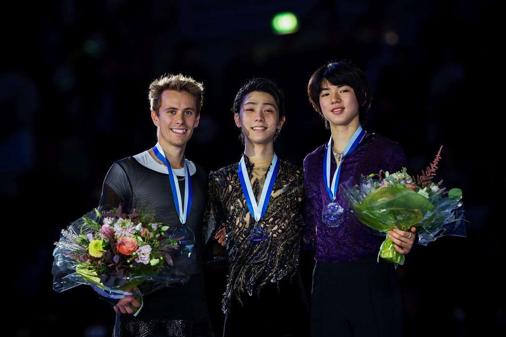 HELSINKI, FINLAND - NOVEMBER 4: (L-R) Michal Brezina of Czech Republic, Yuzuru Hanyu of Japan and  Junhwan Cha of Korea pose in the Men's medal ceremony during day three of the ISU Grand Prix of Figure Skating at the Helsinki Arena on November 4, 2018 in Helsinki, Finland. (Photo by Joosep Martinson - International Skating Union (ISU)/ISU via Getty Images)