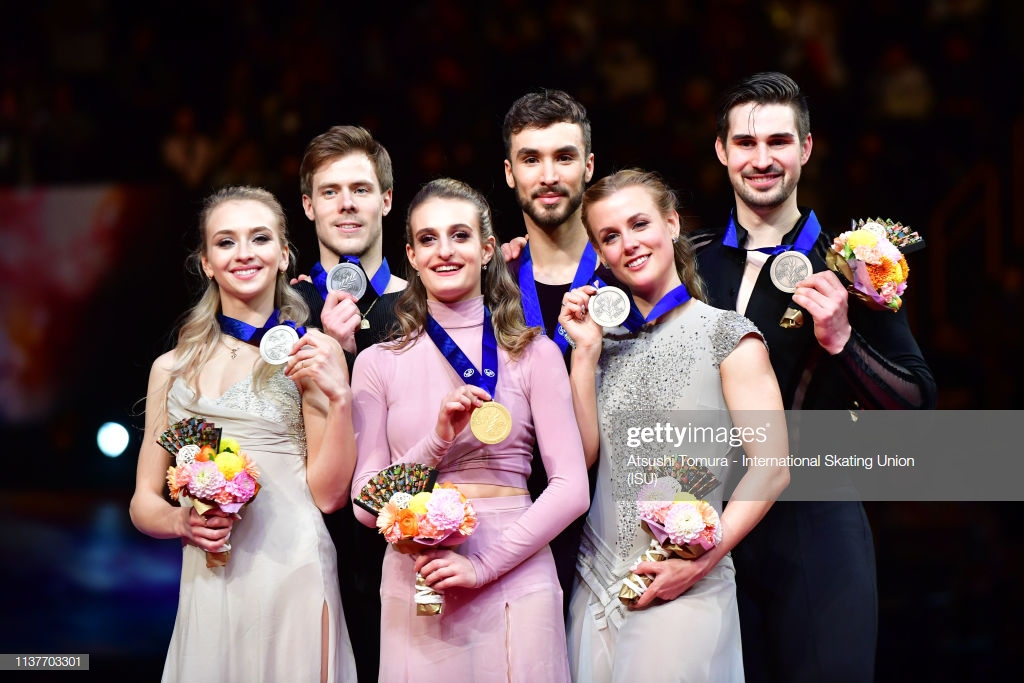 SAITAMA, JAPAN - MARCH 23: (L to R) Victoria Sinitsina and Nikita Katsalapov of Russia, gold medalists Gabriella Papadakis and Guillaume Cizeron of France and bronze medalists Madison Hubbell and Zachary Donohue of the United States pose on the podium at the medal ceremony for the Ice Dance on day four of the 2019 ISU World Figure Skating Championships at Saitama Super Arena on March 23, 2019 in Saitama, Japan. (Photo by Atsushi Tomura - International Skating Union (ISU)