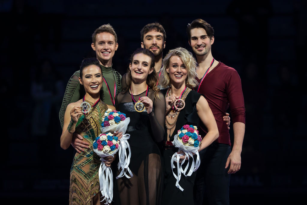 TURIN, ITALY - DECEMBER 07: (L-R) Madison Chock and Evan Bates of United States, Gabriella Papadakis and Guillaume Cizeron of France and Madison Hubbell and Zachary Donohue of the United States pose in the Ice Dance medal ceremony during the ISU Grand Prix of Figure Skating Final (Senior & Junior) at Palavela Arena on December 07, 2019 in Turin, Italy. (Photo by Joosep Martinson - International Skating Union/International Skating Union via Getty Images)